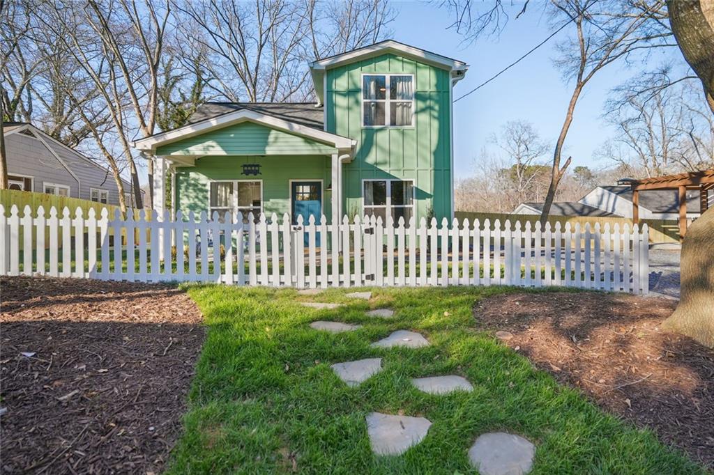 a front view of a house with garden