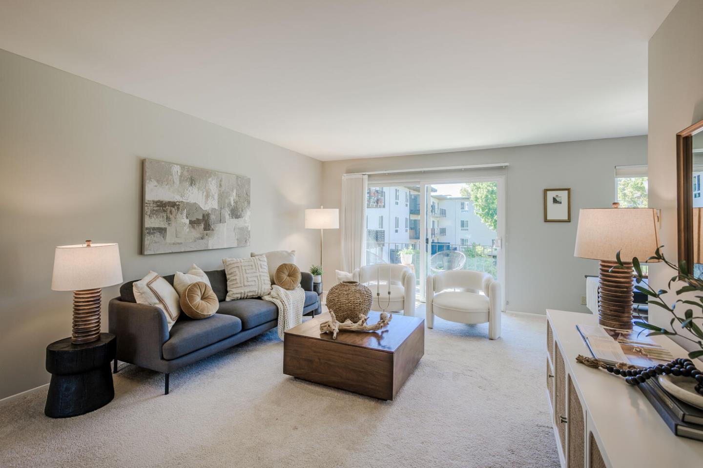 a living room with furniture and a lamp