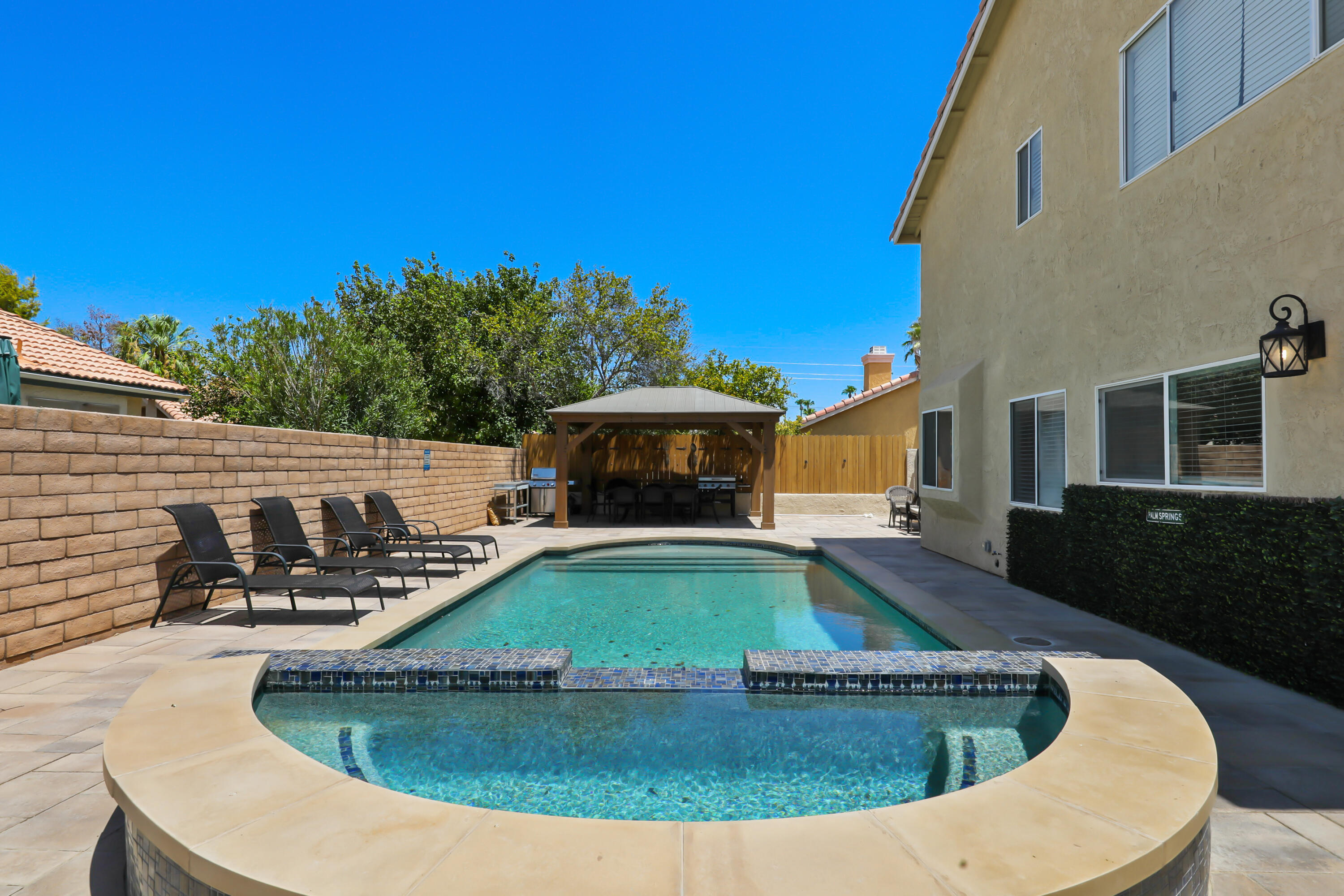 a view of a swimming pool with chairs