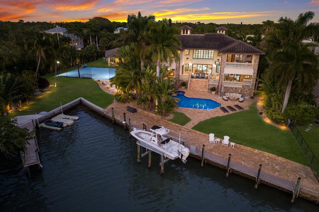 an aerial view of a house with outdoor space