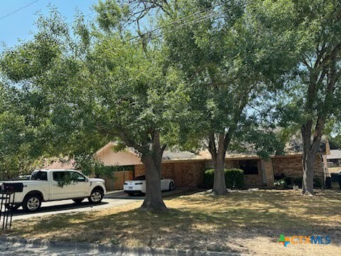 a view of a car parked in front of a house