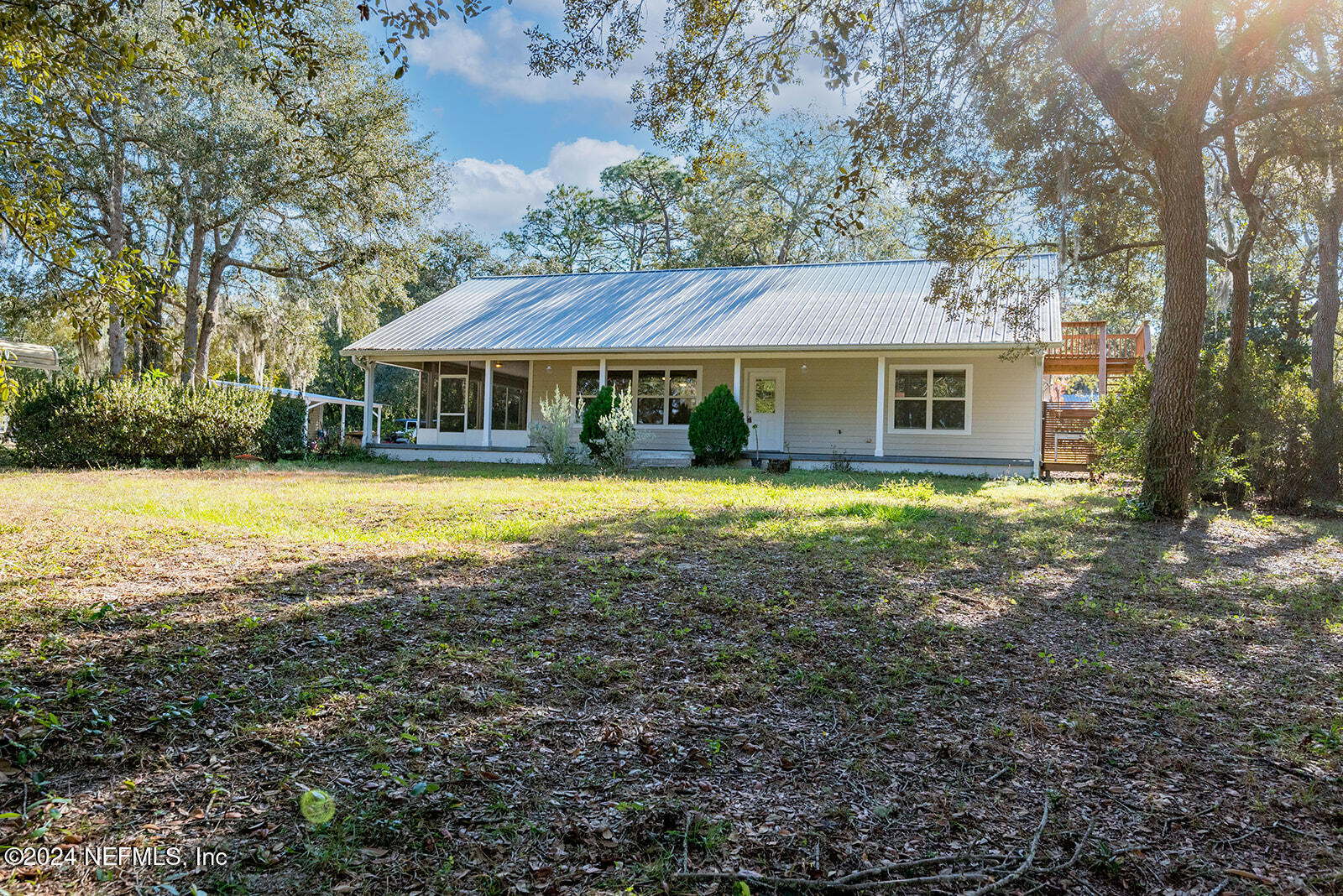 a view of house with yard outdoor seating and barbeque oven