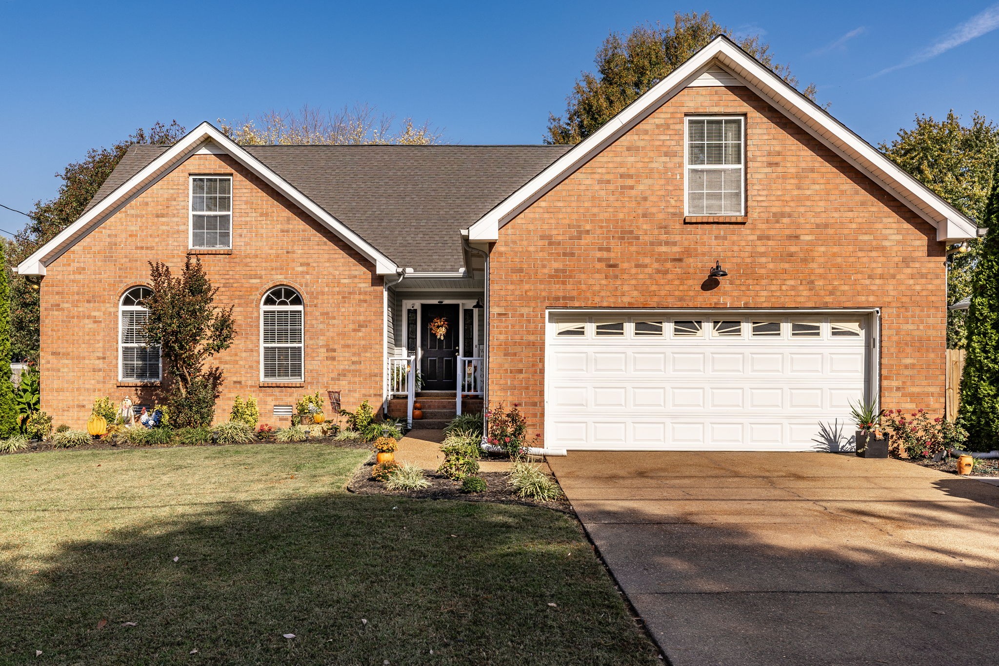 a front view of a house with a yard