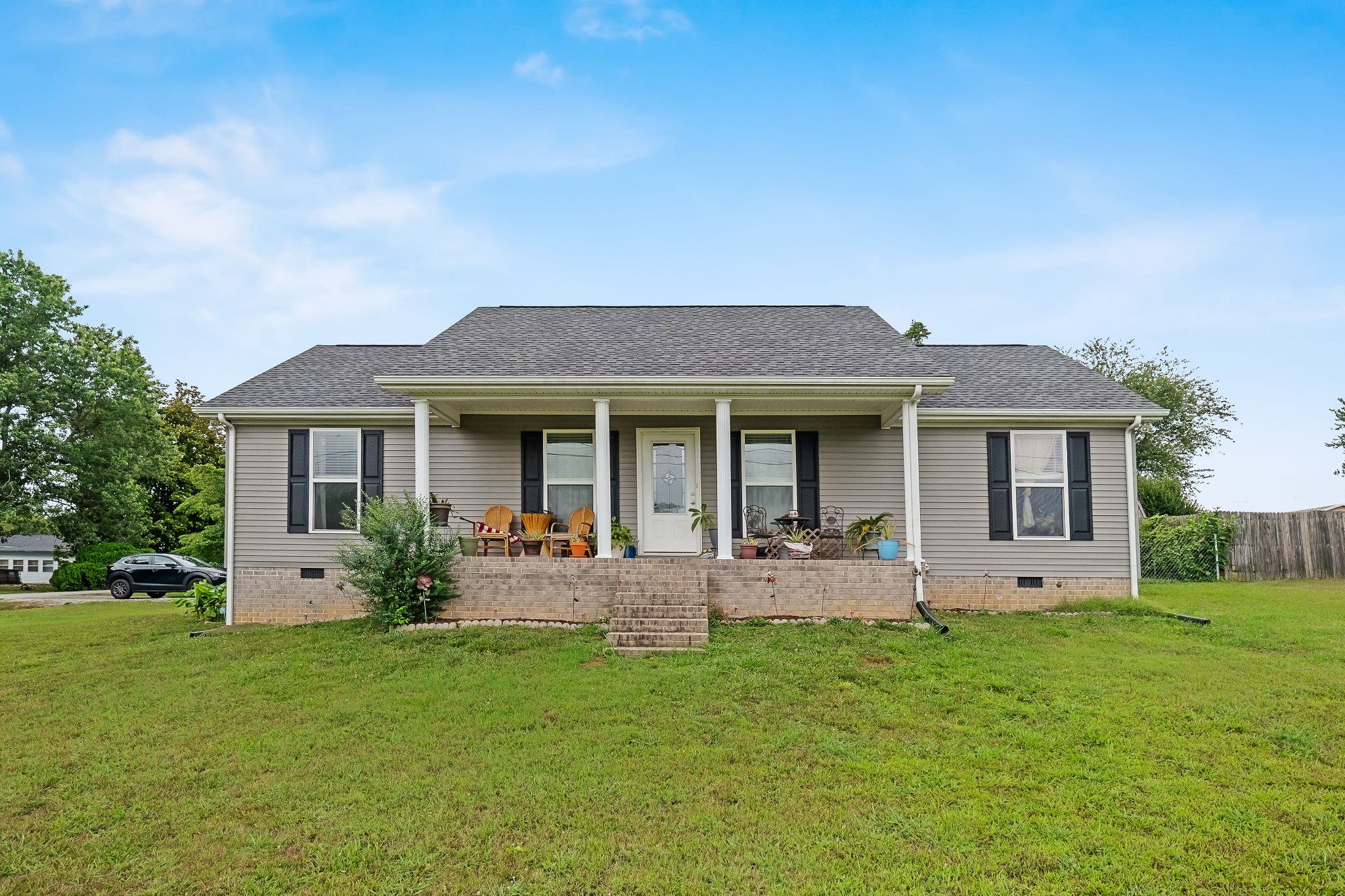 front view of a house with a yard