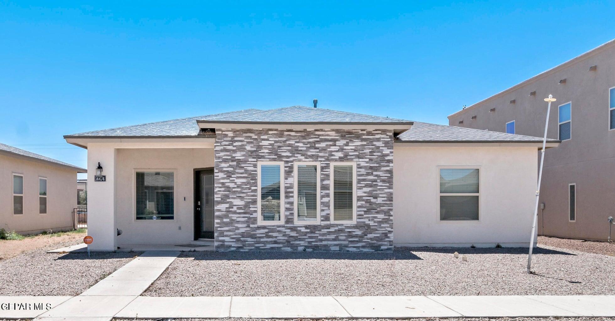 a front view of a house with yard