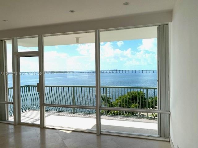 a view of a porch with a floor to ceiling window