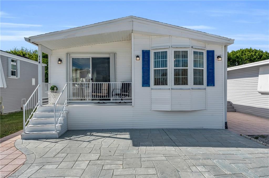 a view of a house with entryway and stairs