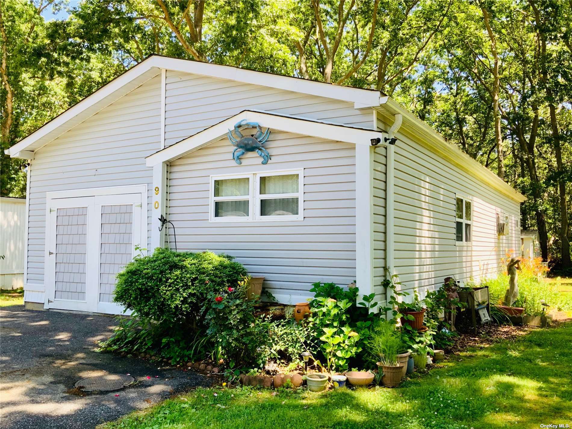 a view of a house with a yard and plants