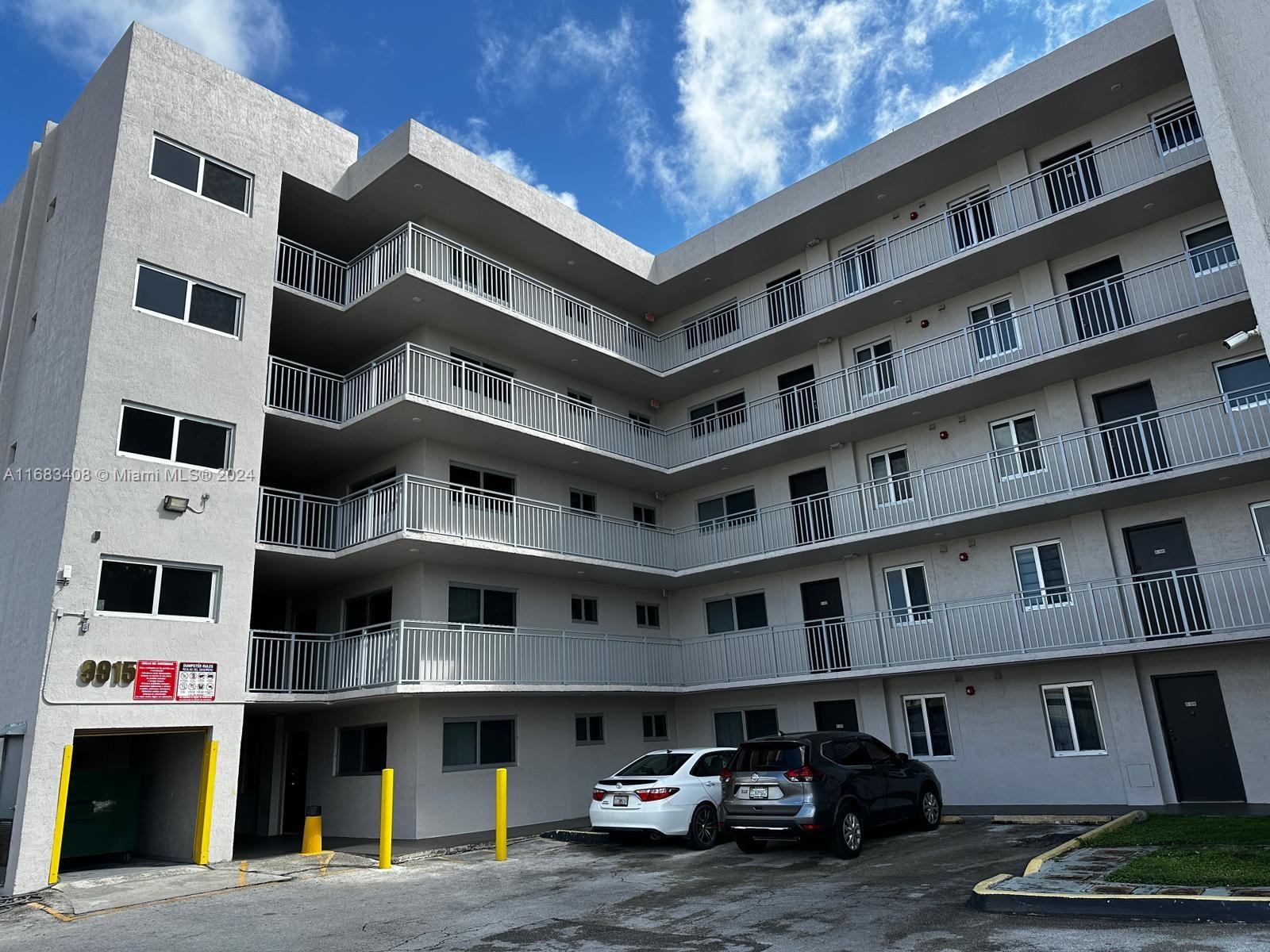 a front view of a building with lot of windows