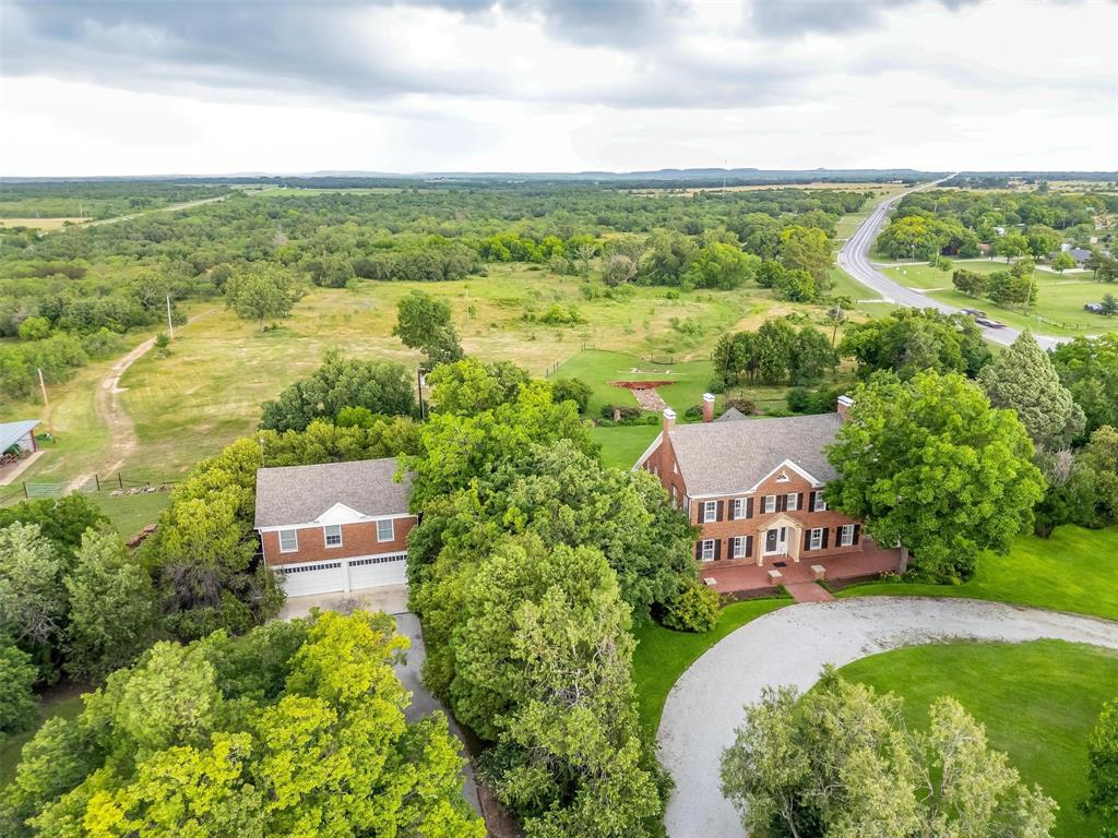 an aerial view of residential house with outdoor space and river