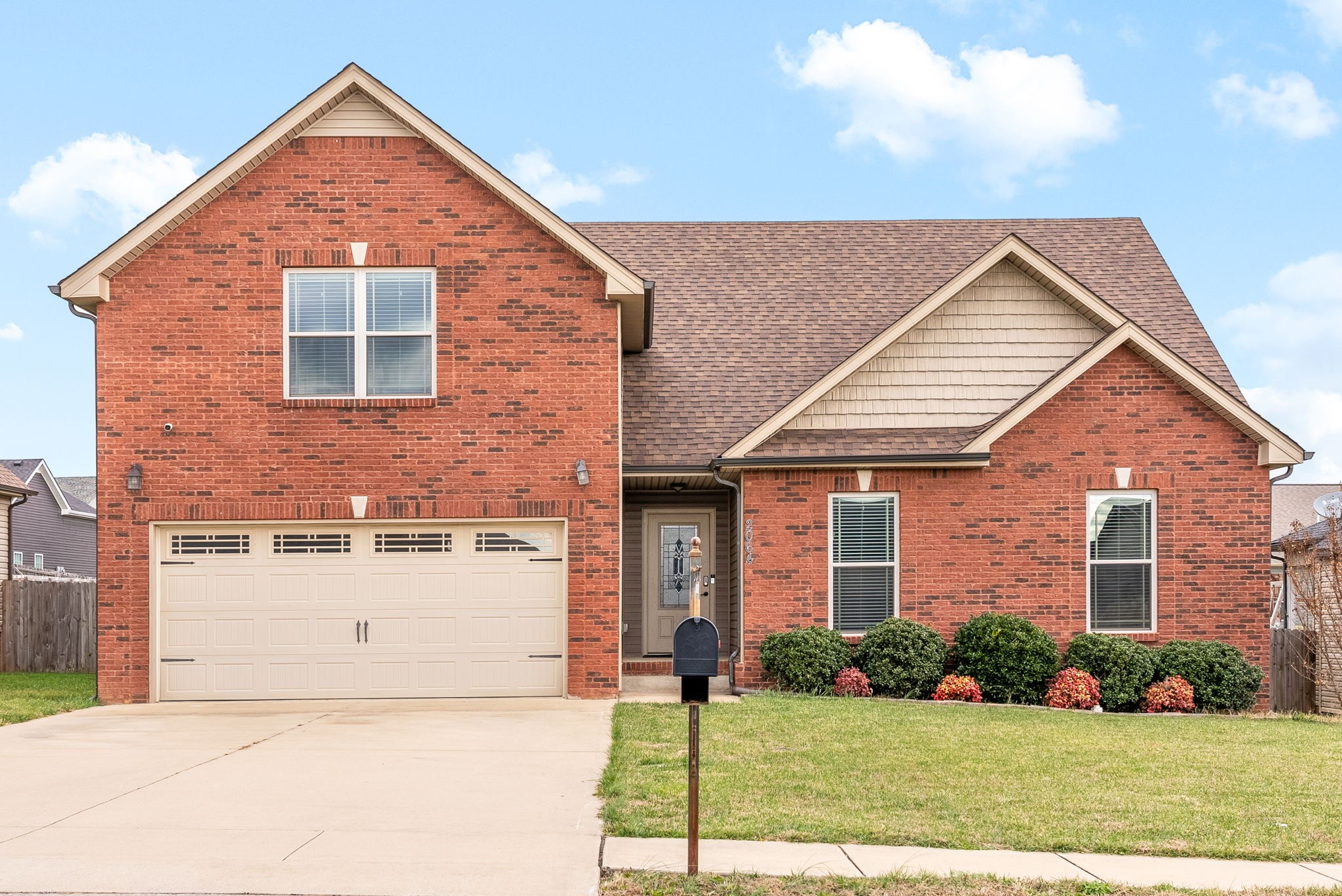 front view of a house with a yard