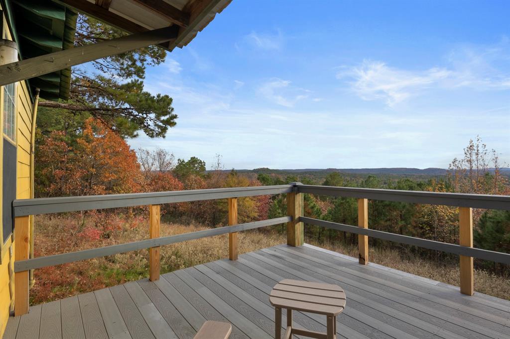 a view of a balcony with wooden floor