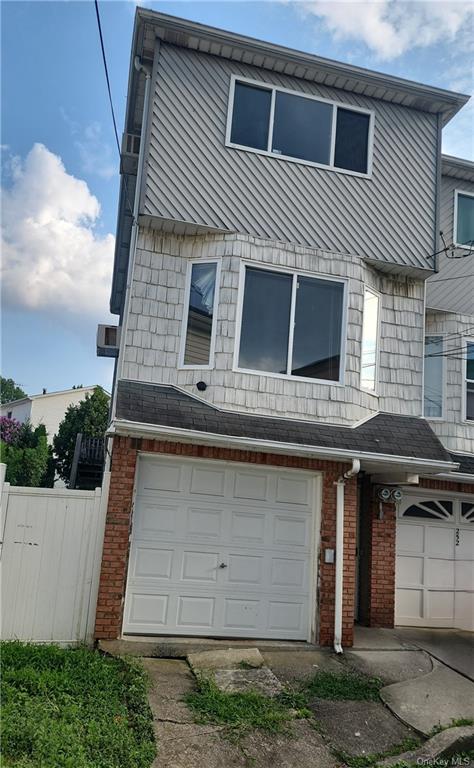 a front view of a house with a garage