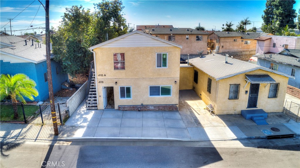 a aerial view of a house with a yard