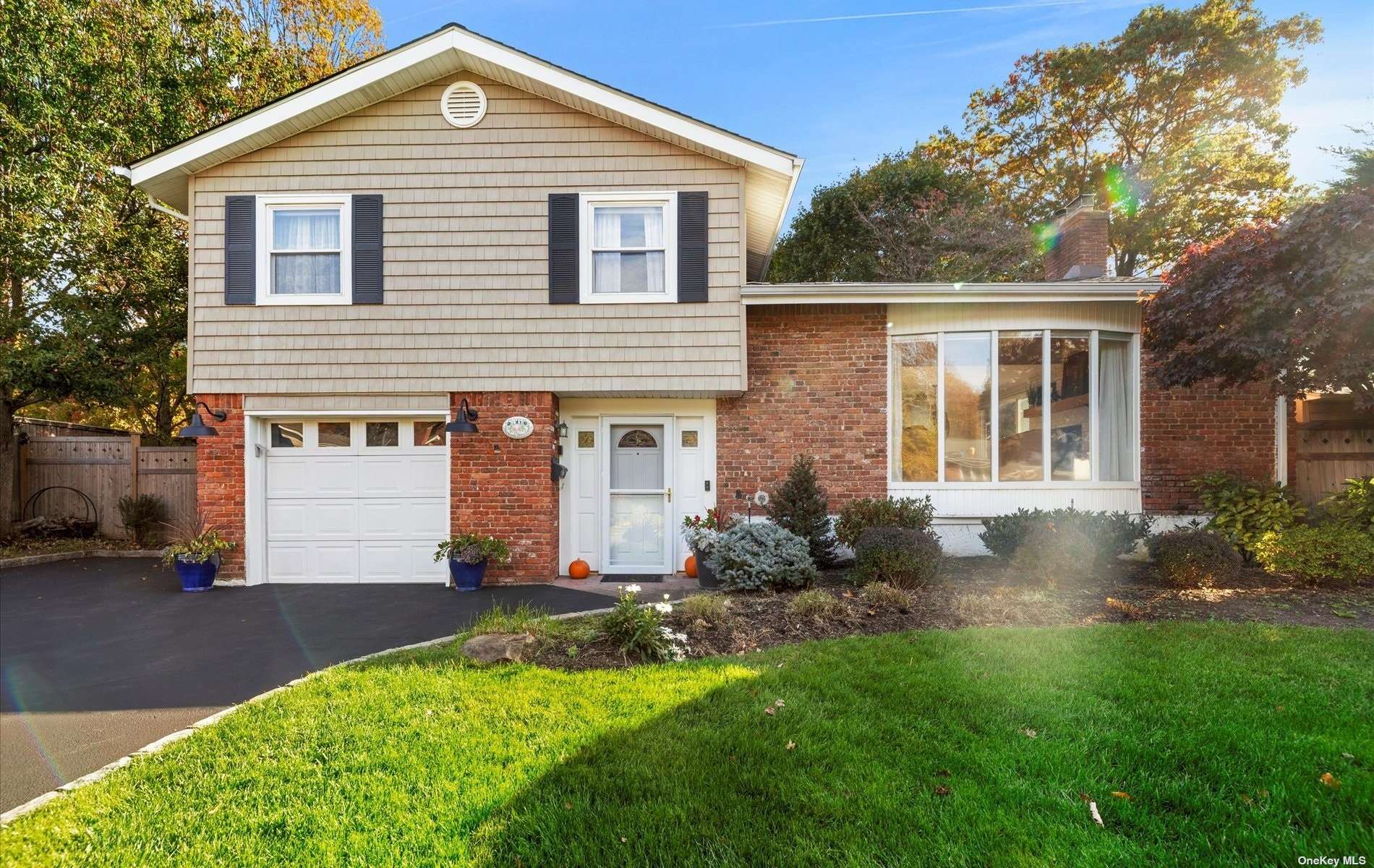 a front view of a house with a yard and porch