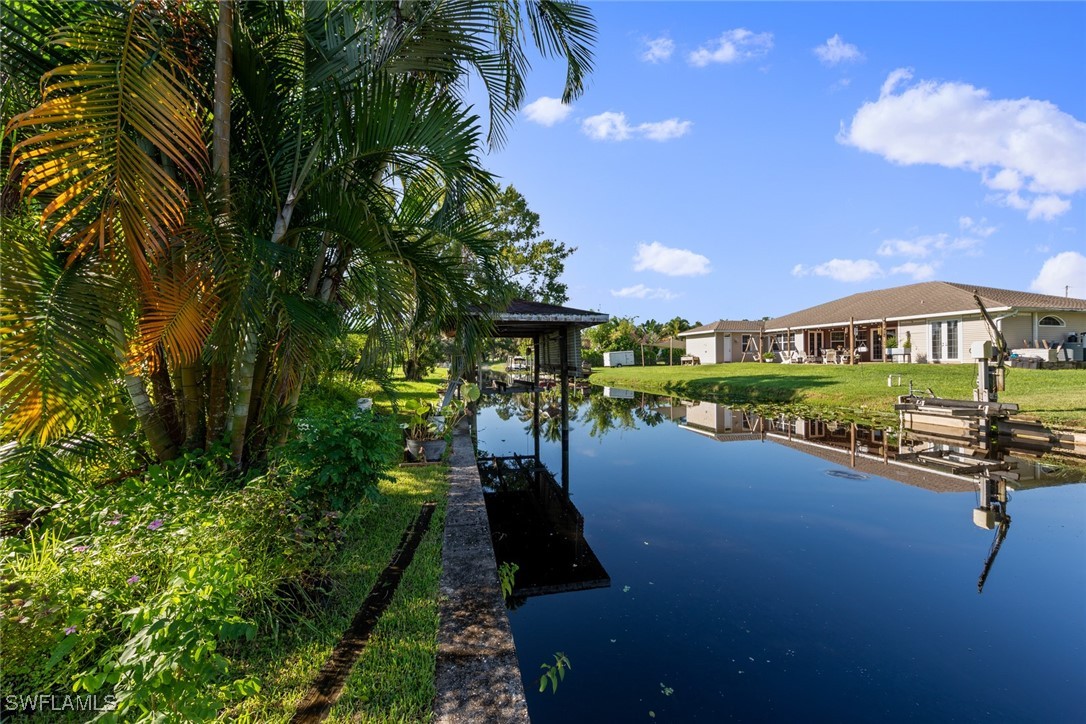 a view of swimming pool outdoor seating and city view