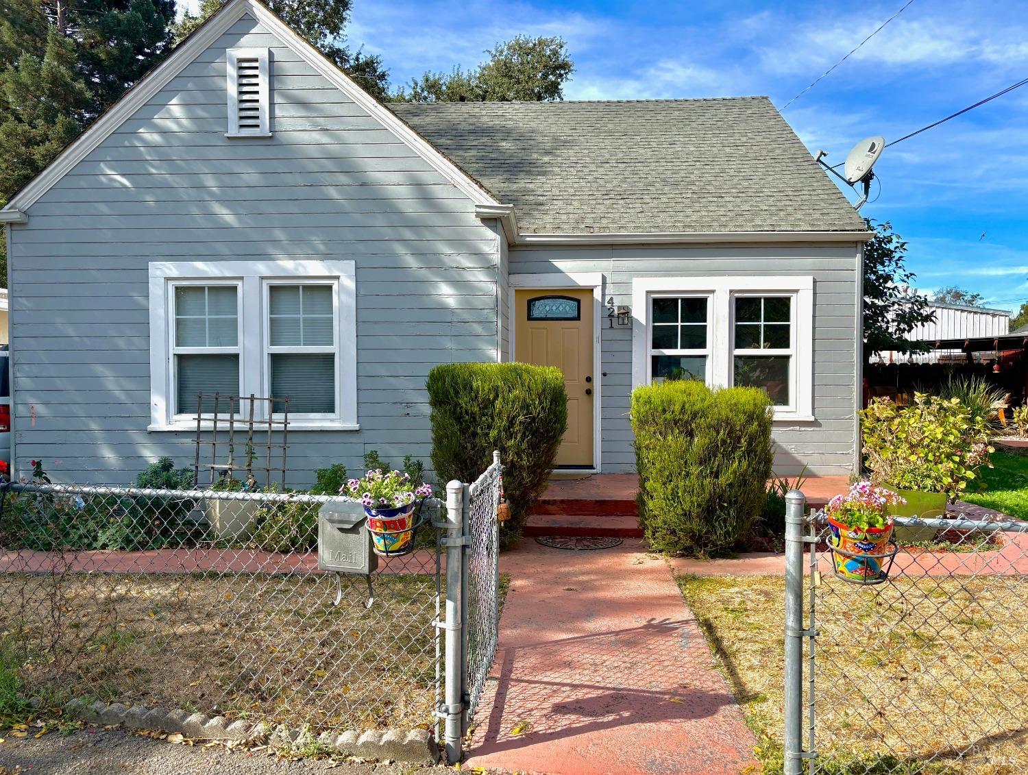 a front view of a house with garden