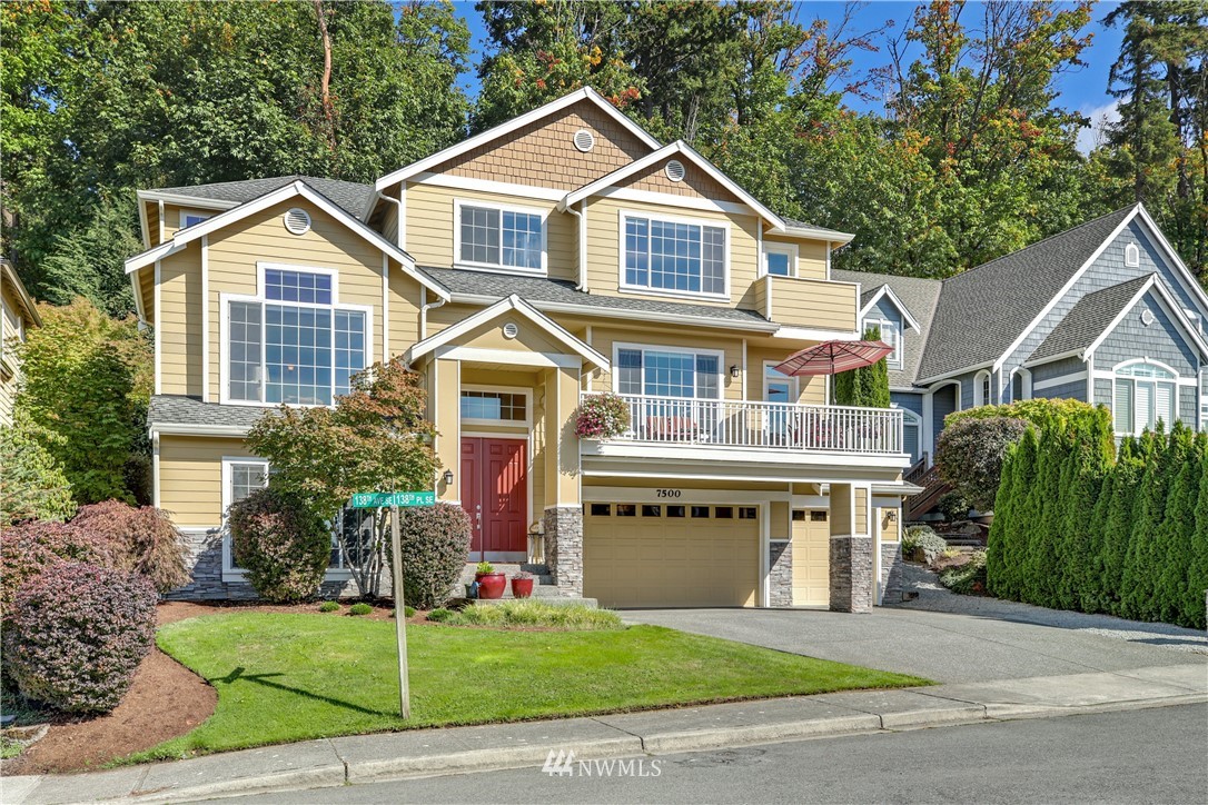 a view of house with yard and swimming pool