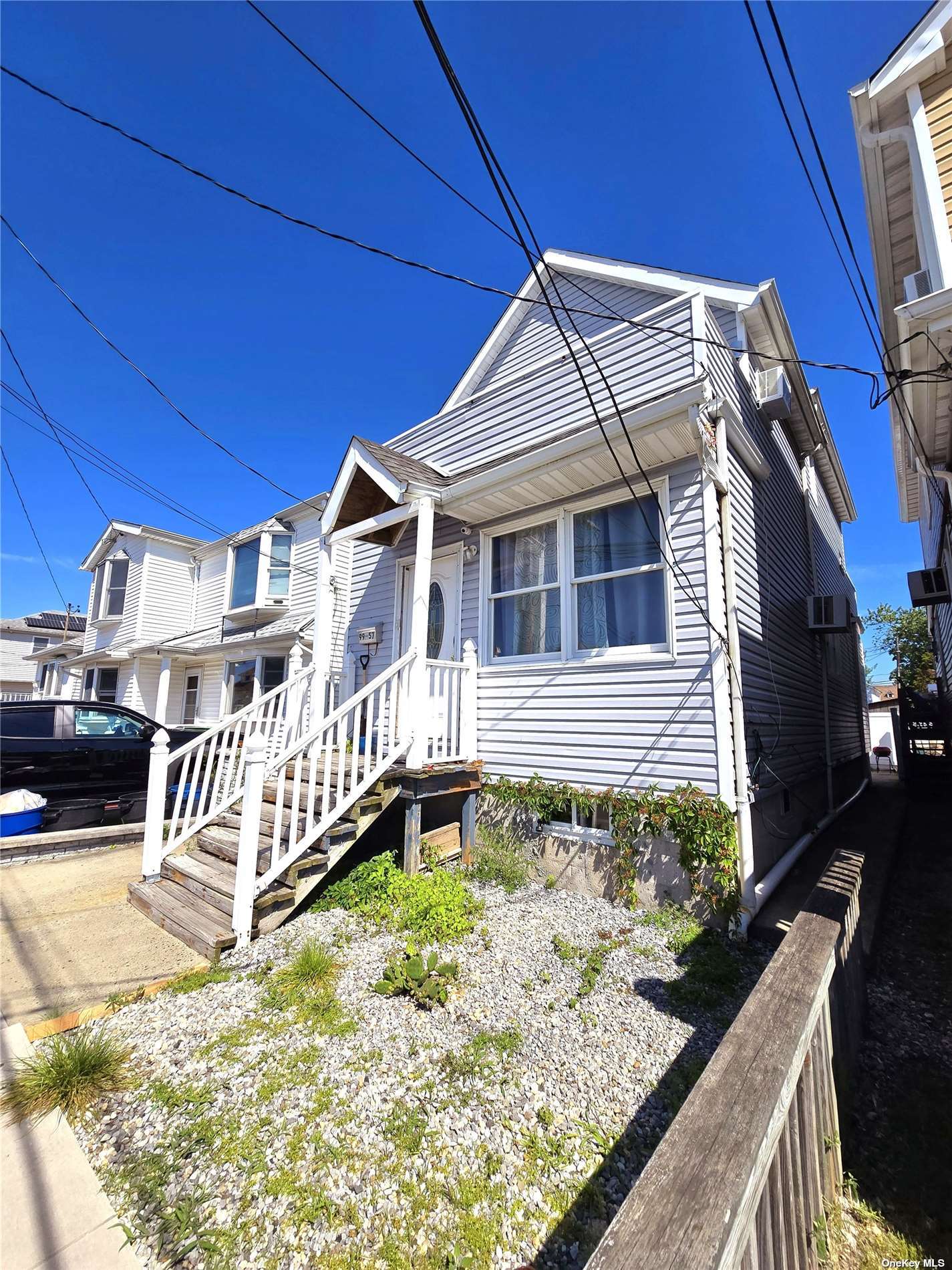 a view of a house with wooden deck