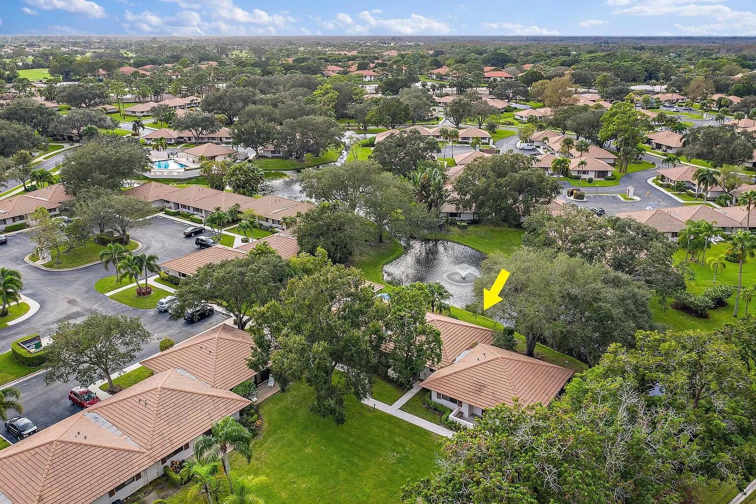 an aerial view of residential houses with outdoor space and river