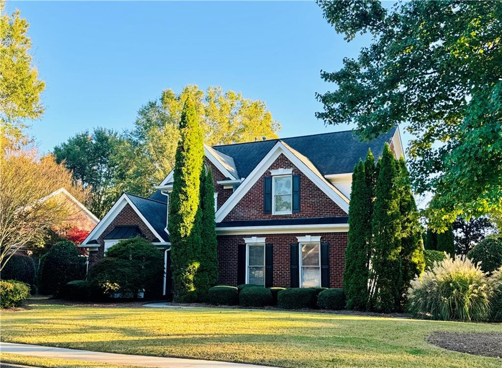 a front view of a house with a yard