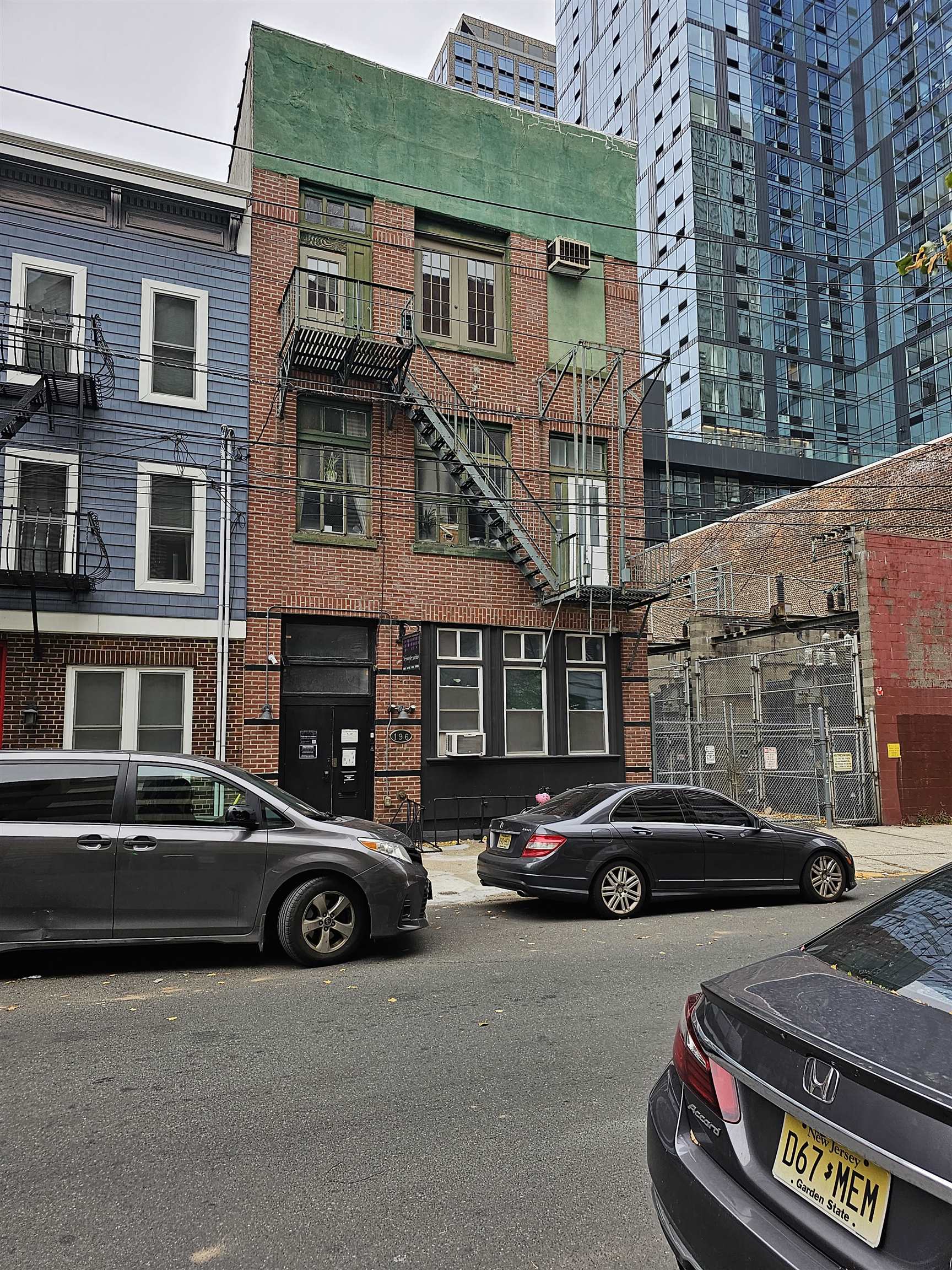 a view of a car parked in front of a building