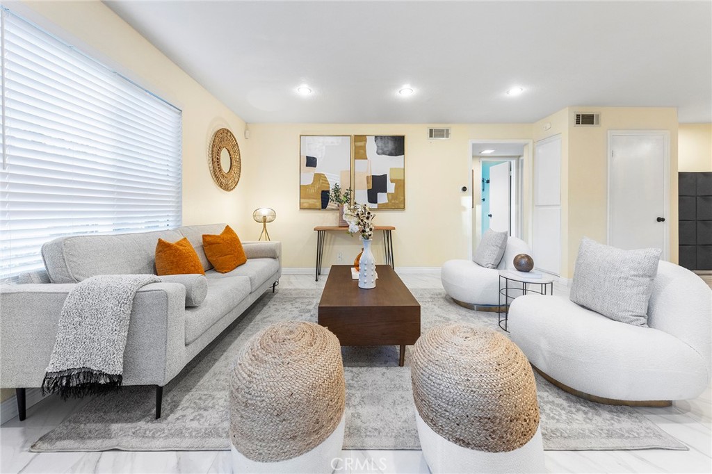 a living room with furniture and a window