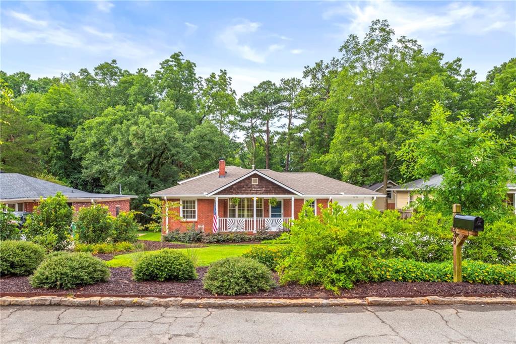 a house with trees in the background