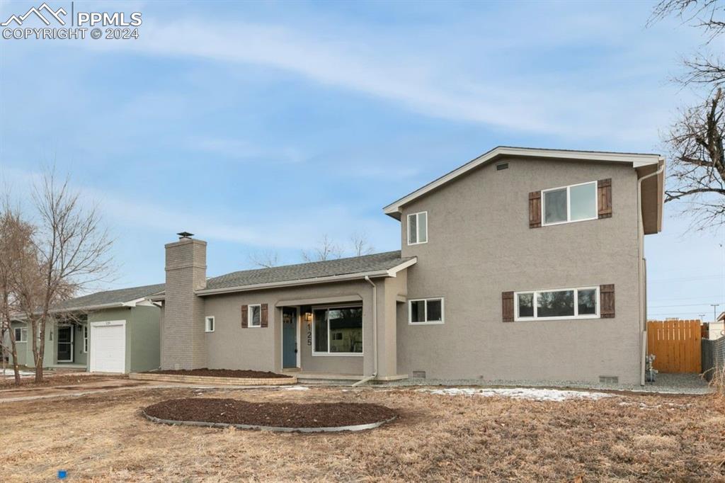 Back of house featuring a garage