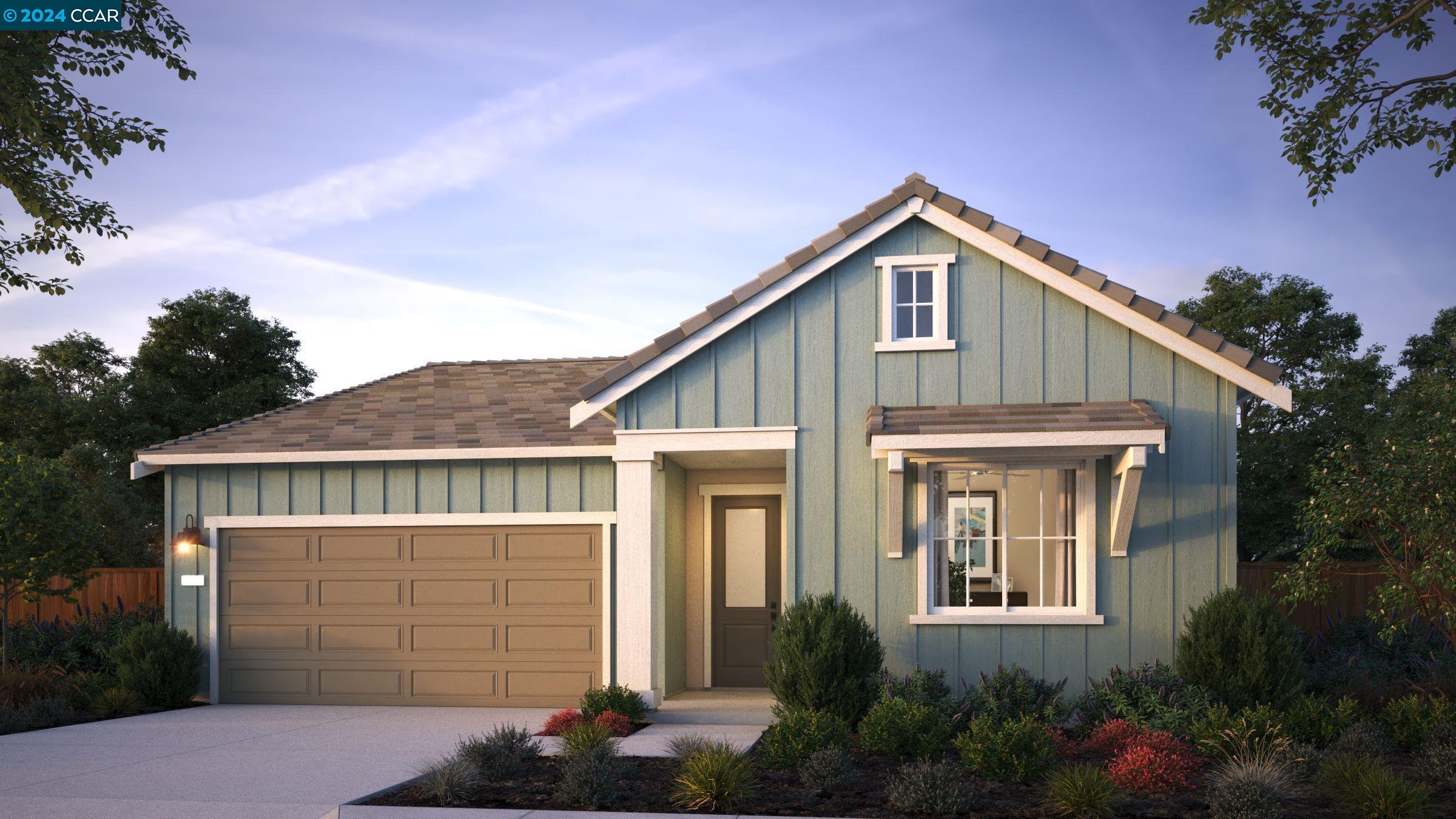 a front view of a house with garage