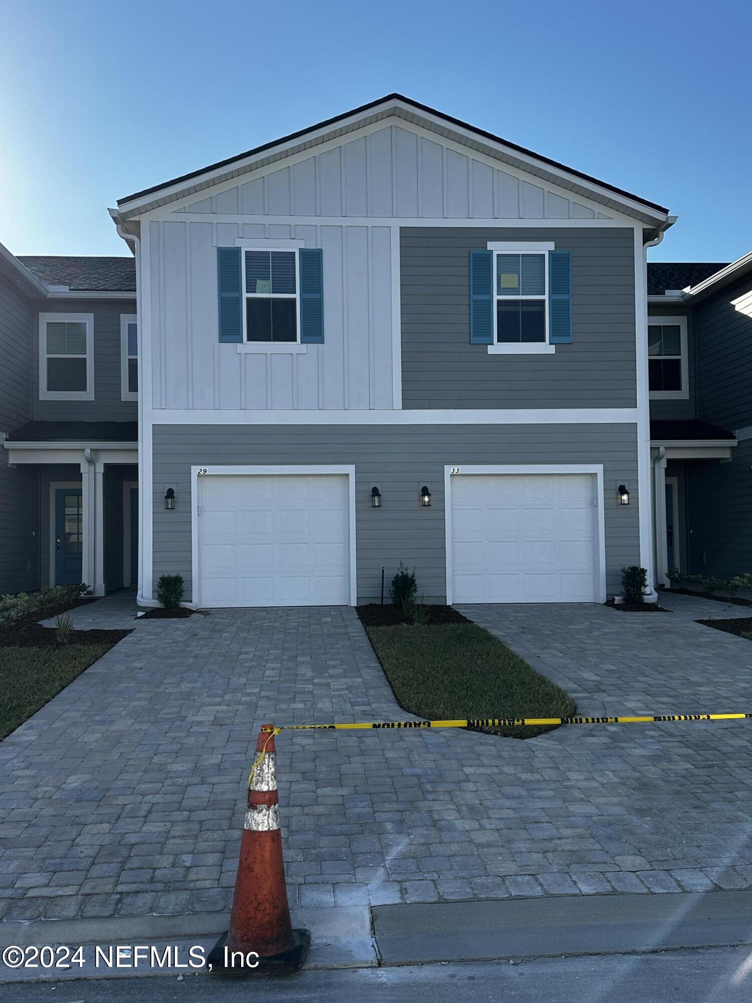 a front view of a house with yard