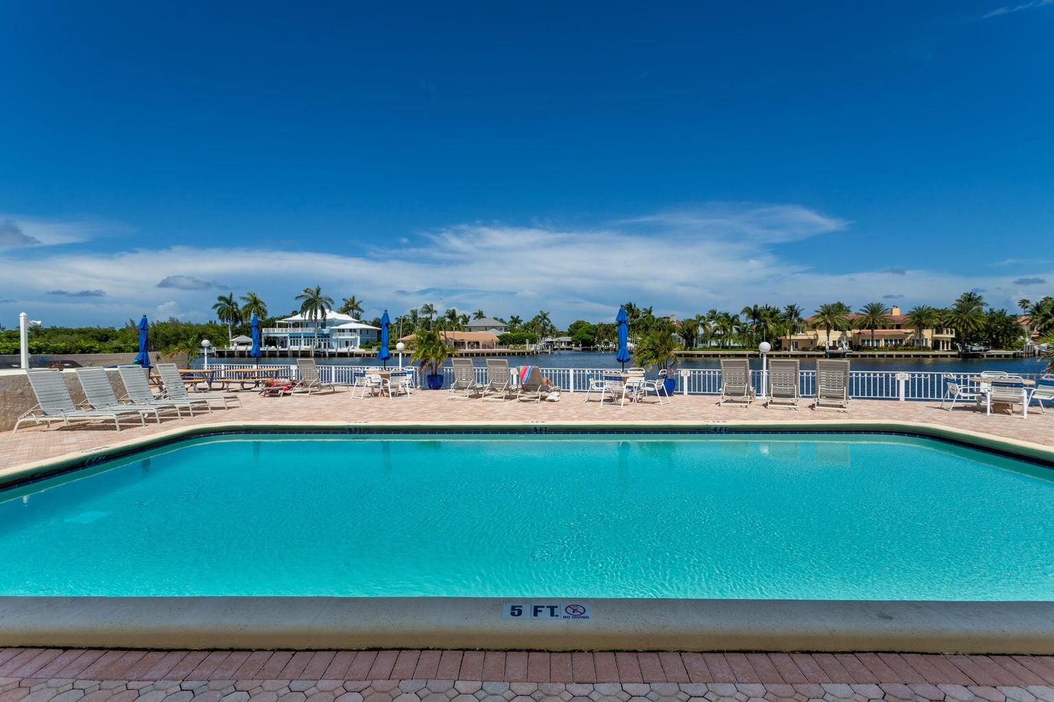 a view of swimming pool with outdoor space and seating area