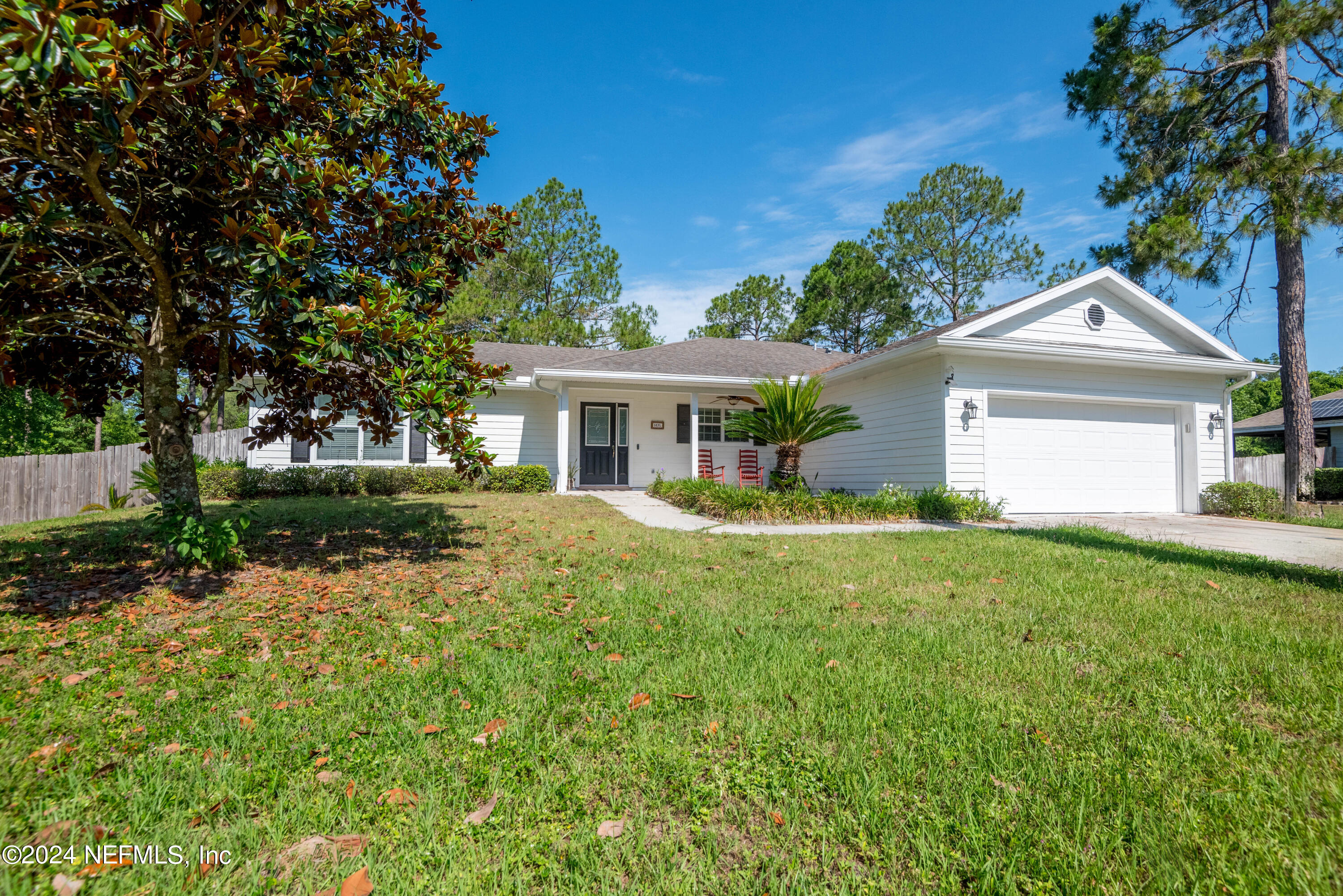 a view of house with a yard