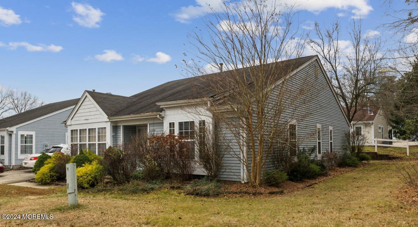 a view of house with yard