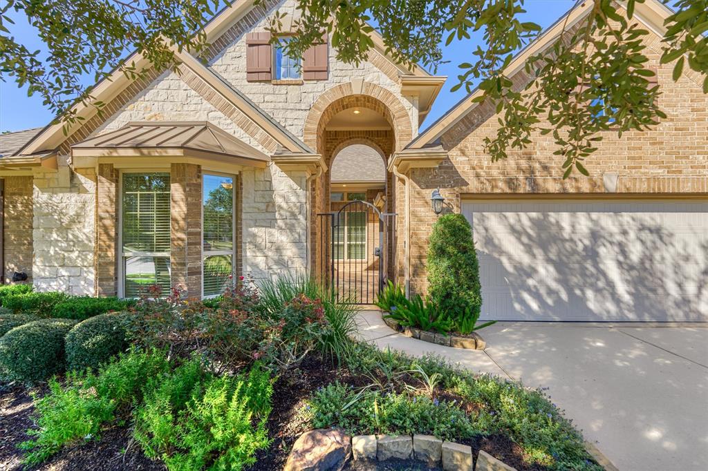 Featuring timeless brick elevation and manicured gardens, 22809 Windward Meadow is the perfect blend of flow and function in sought after Woodridge Forest!  Talking points include WHOLE HOME GENERATOR, recent roof, oversized garage, smart home design, and private, greenbelt lot!