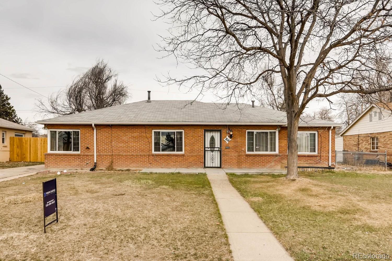 a front view of a house with yard