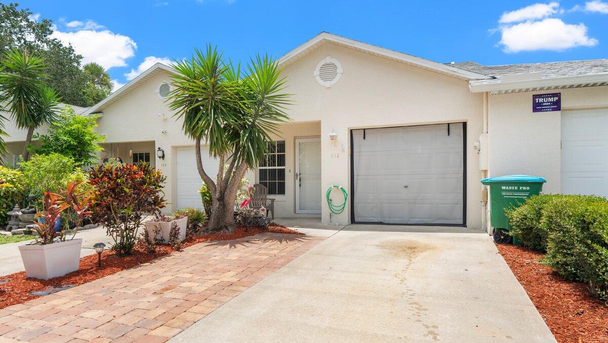 a front view of house with yard and seating space