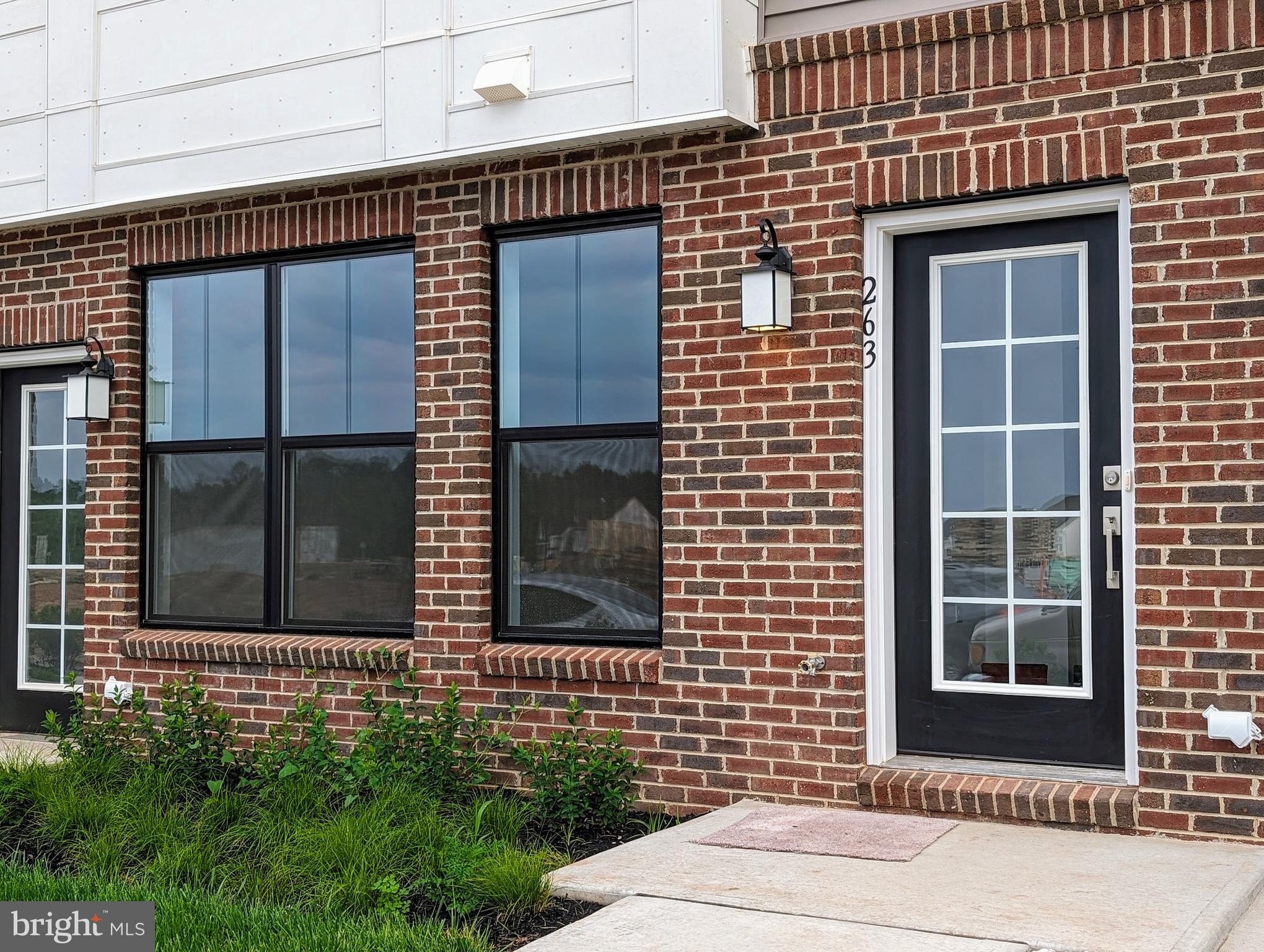 a brick house with a door and a window