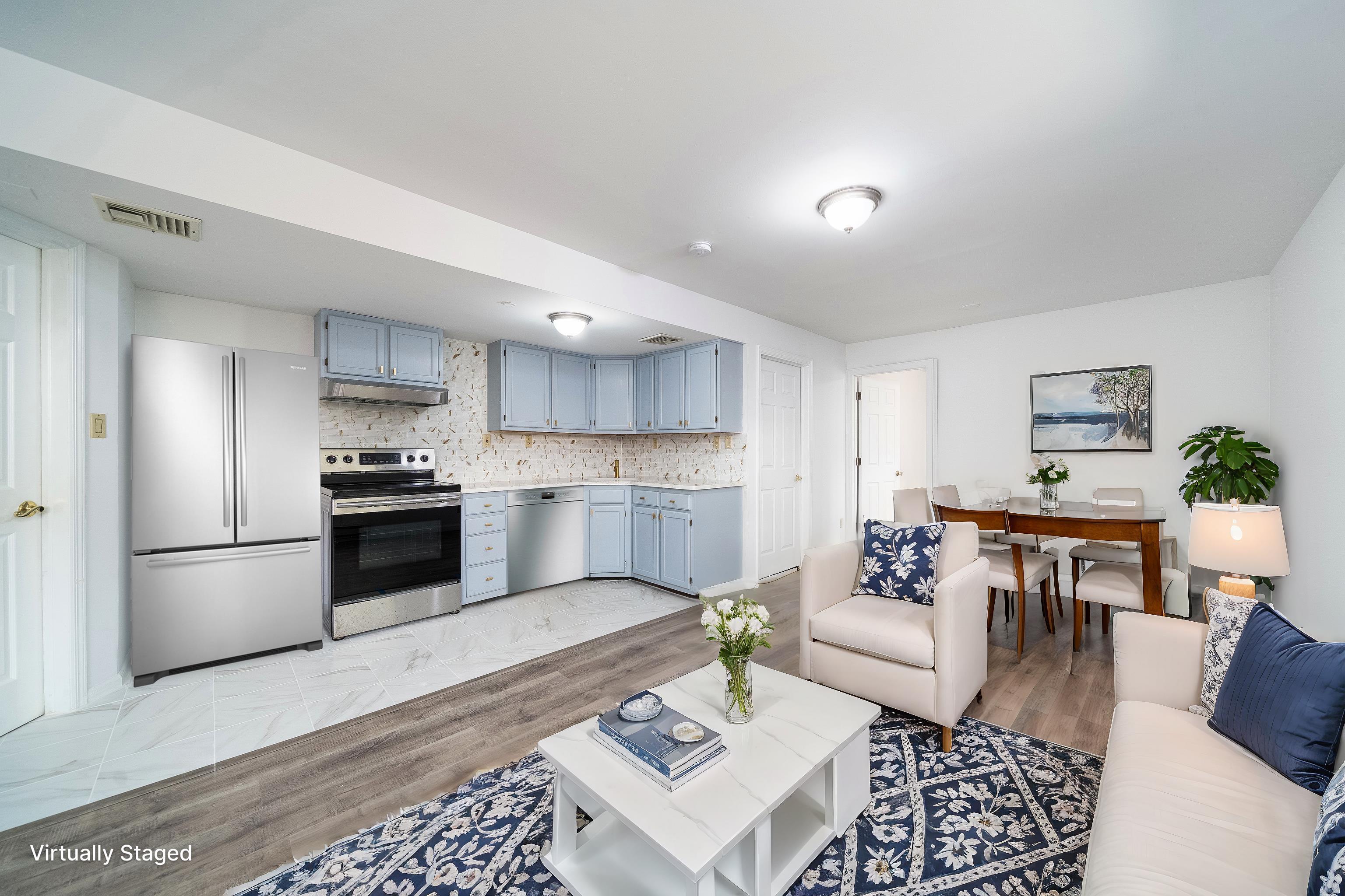 a kitchen with a refrigerator and a stove top oven