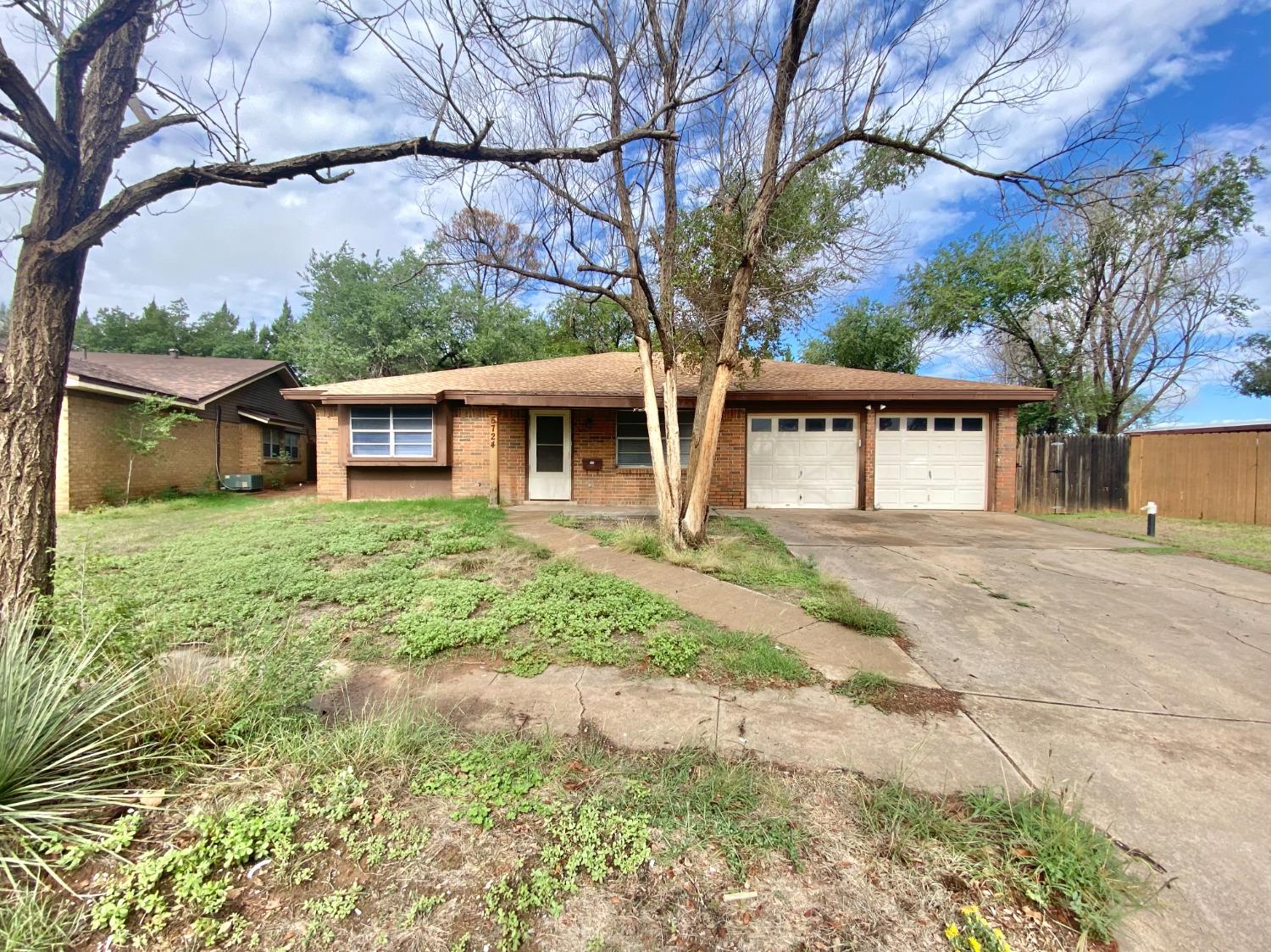 a house with trees in front of it