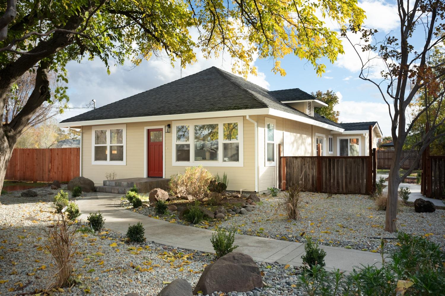 a front view of a house with garden