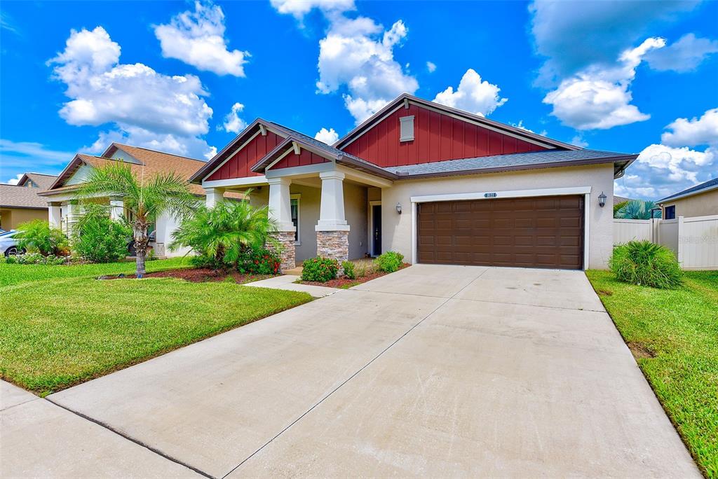 a front view of a house with yard