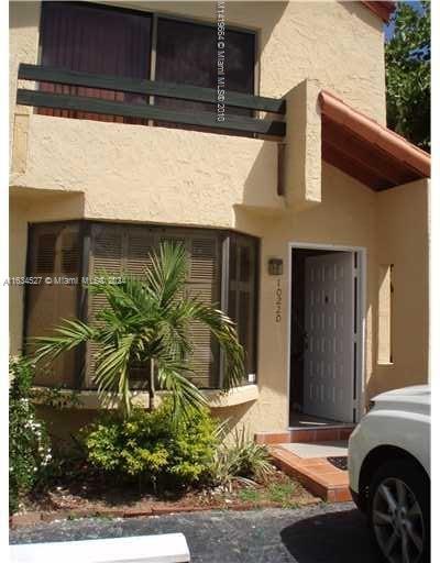 a front view of a house with a garage