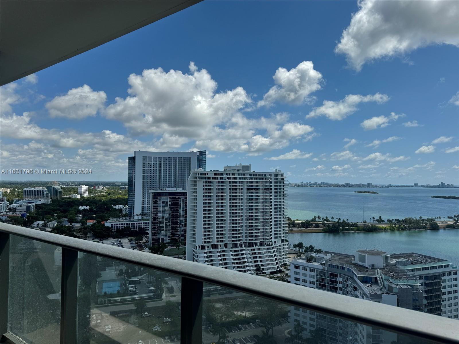 a view of a lake from a balcony