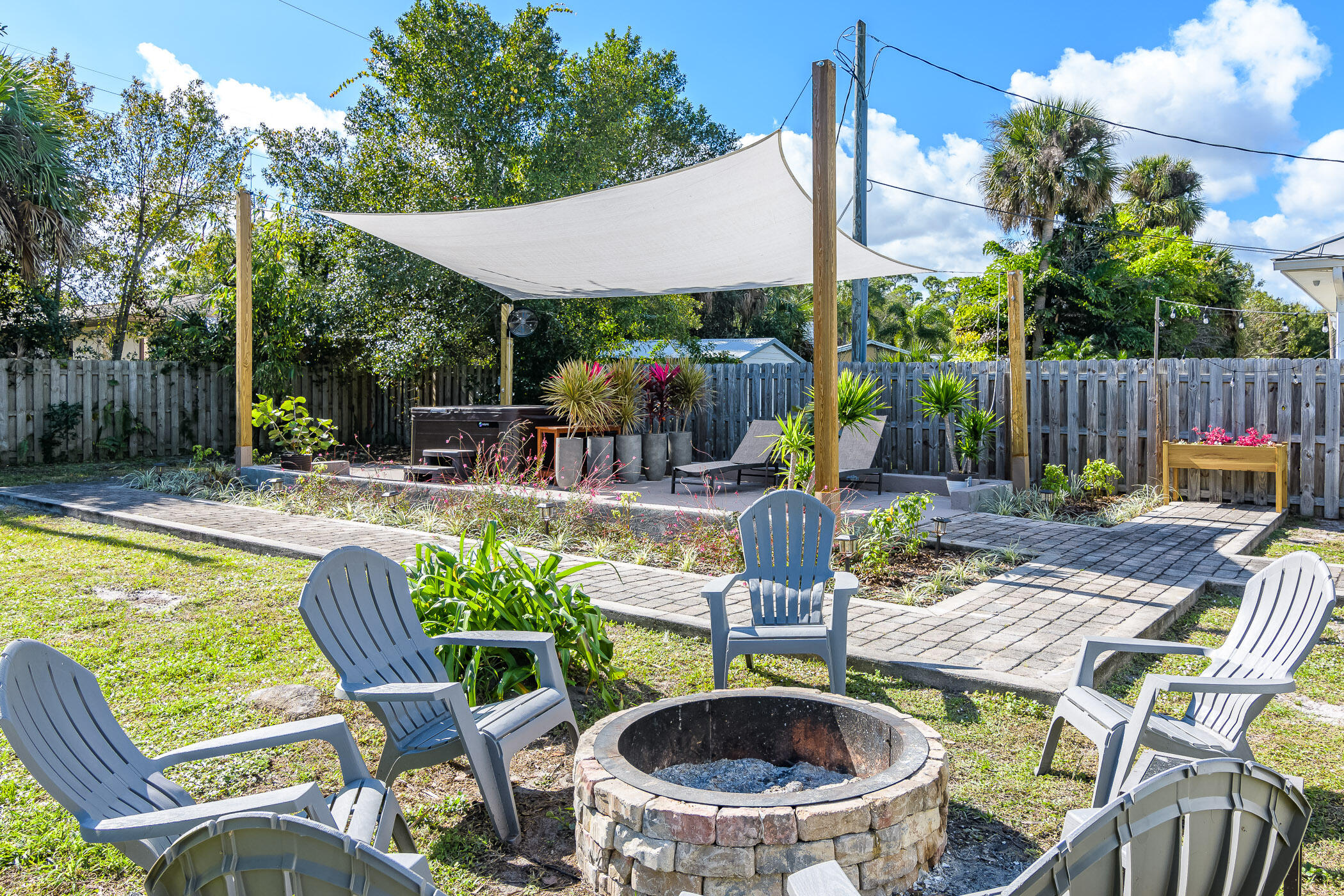 a view of an outdoor sitting area with furniture and garden