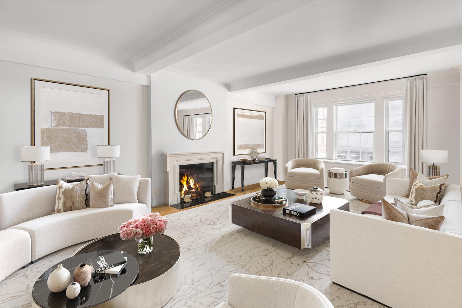 a living room with furniture a fireplace and a large window