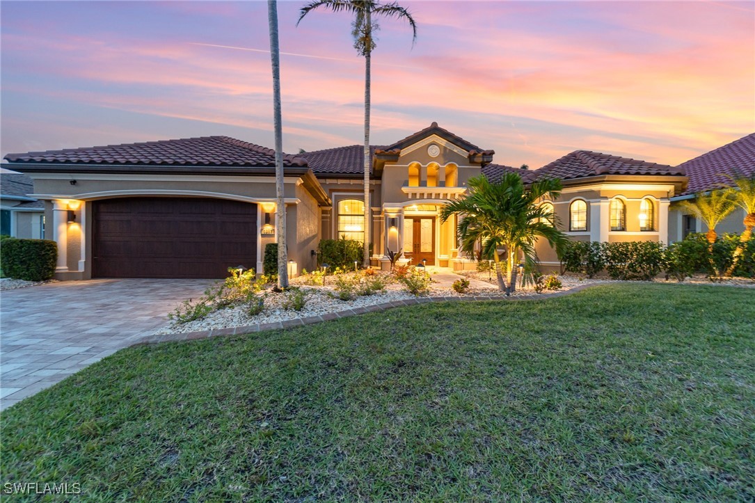 a front view of a house with a yard