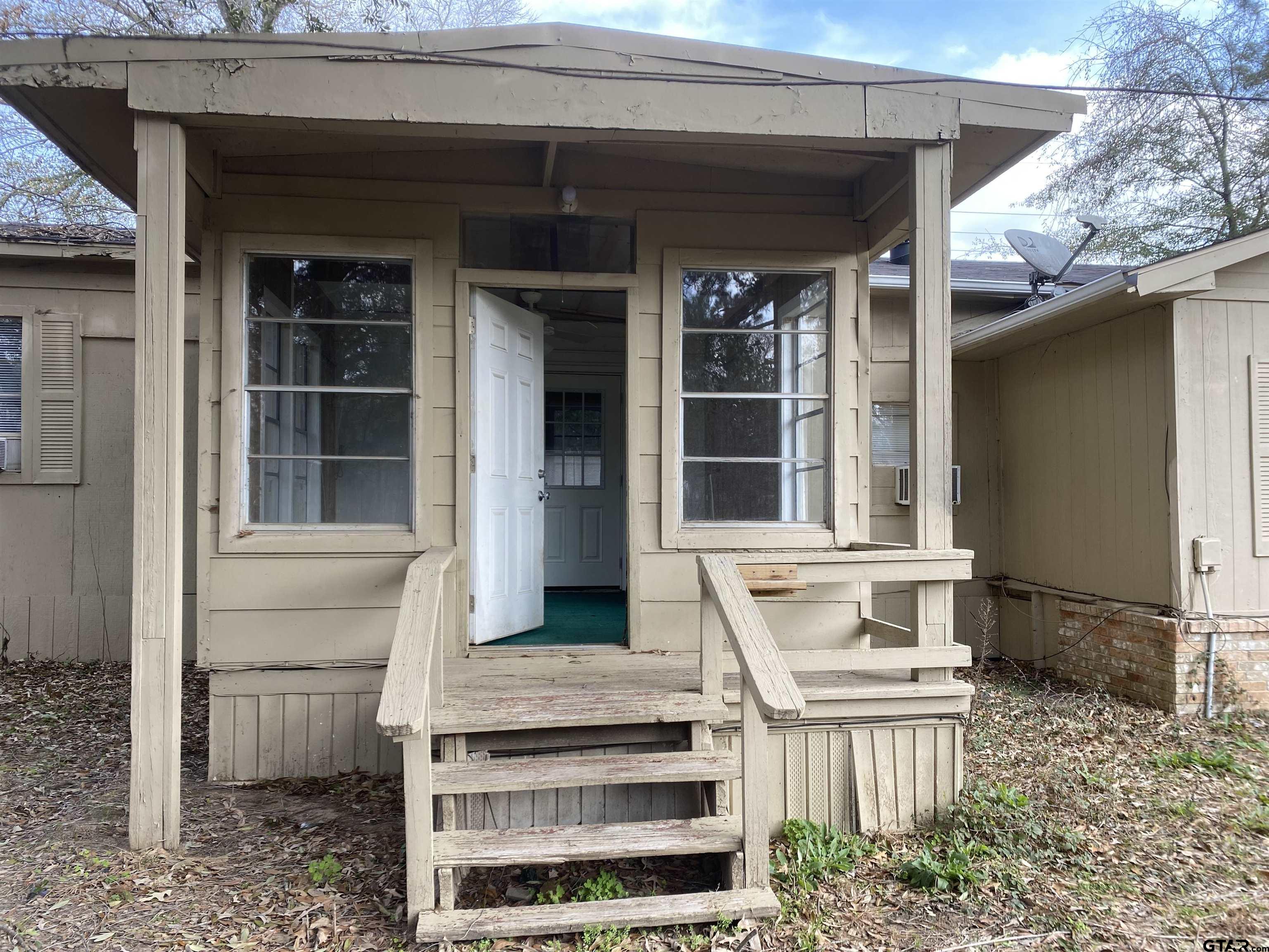 a view of house with outdoor space