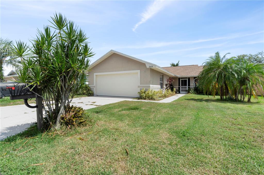 a view of house with yard and entertaining space