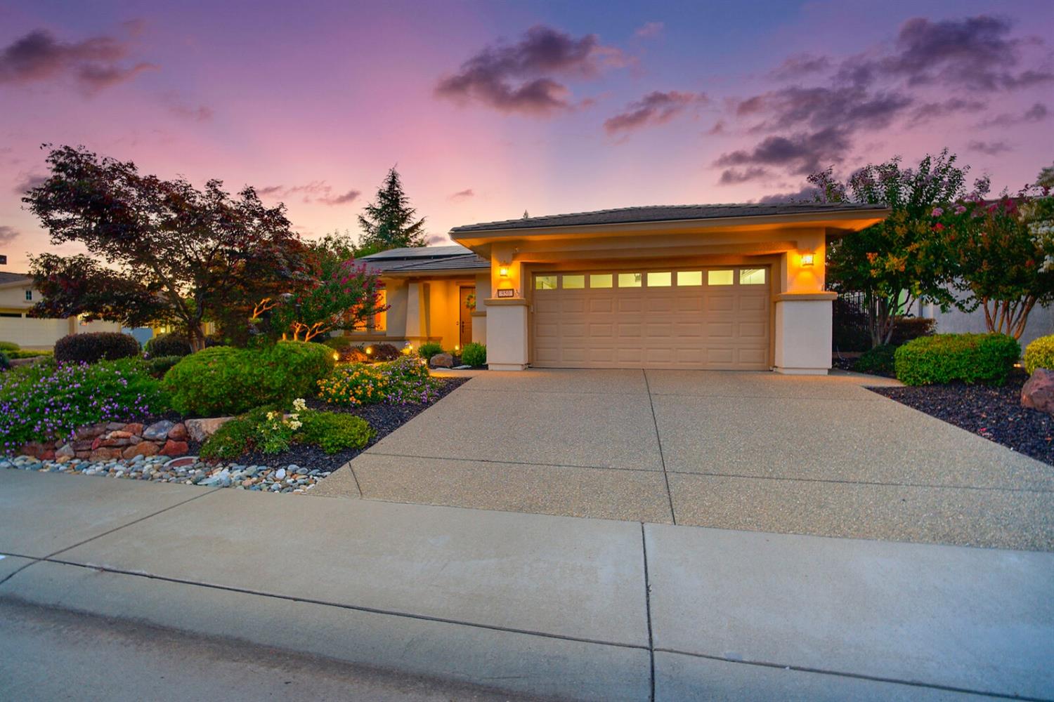 a front view of a house with a garage